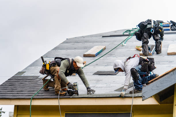 Professional Roofing technician working in Wayland, MA